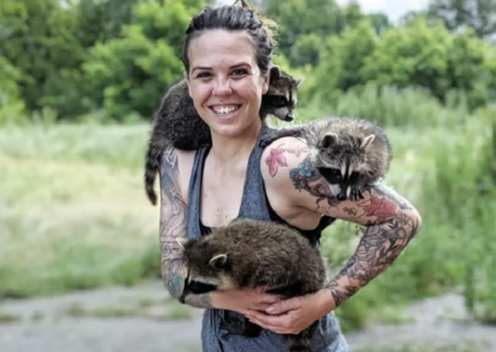 Katie and the orphaned raccoons.