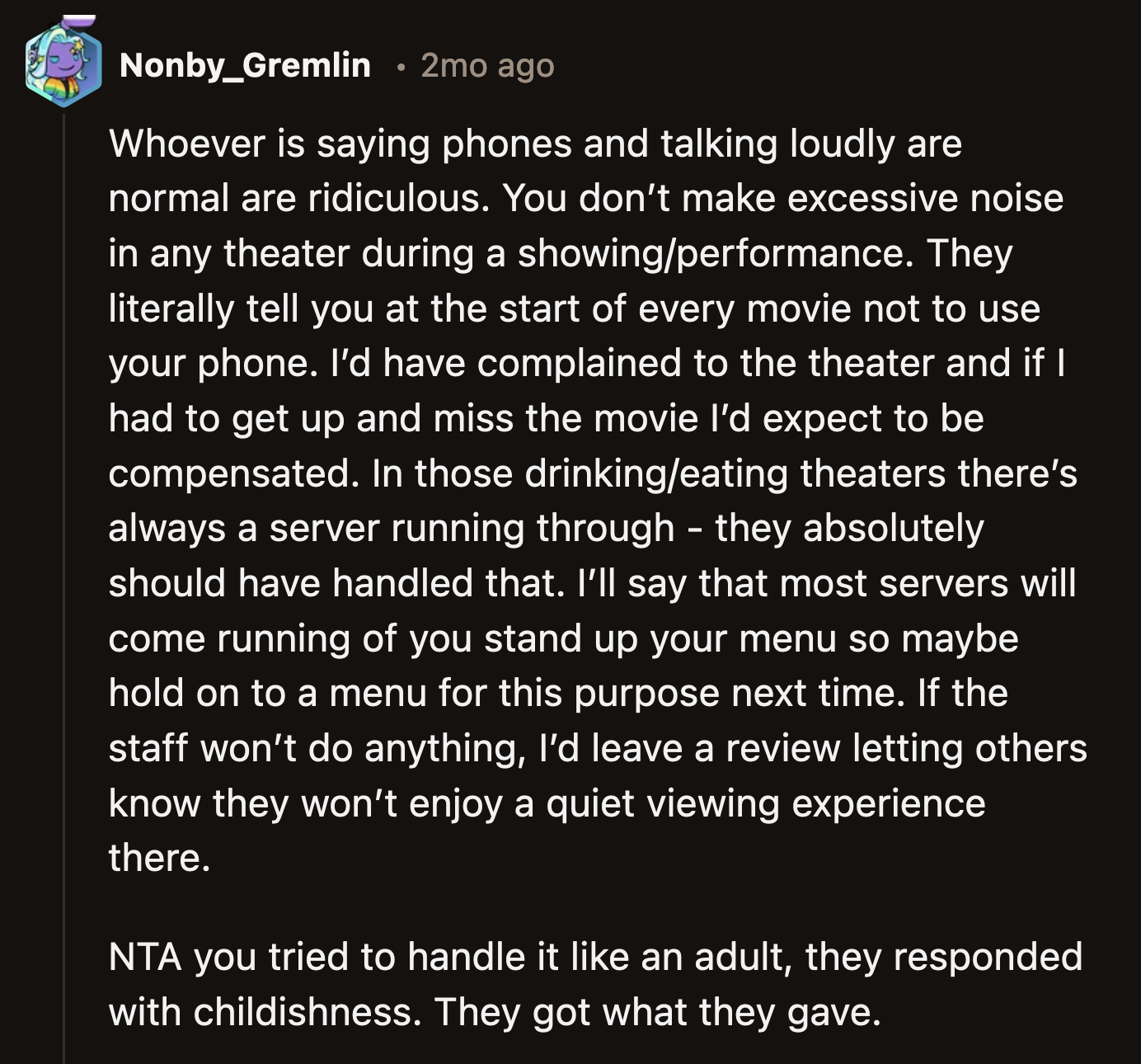 OP tried to talk to the woman reasonably at first. Sure, OP could have reported the issue to a theater staff, but the popcorn was just as effective.