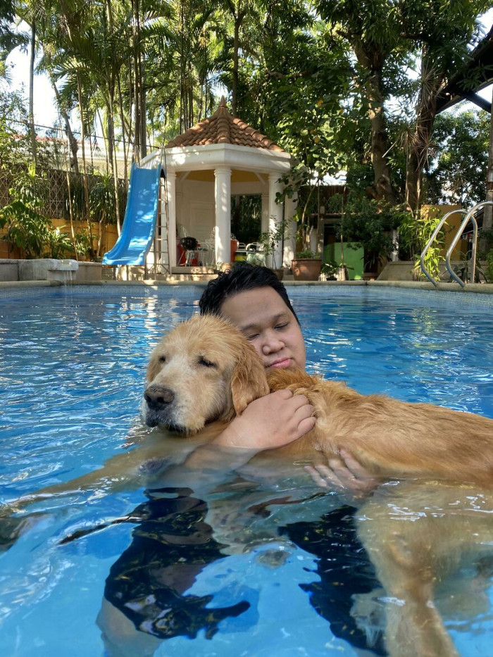 1. My Senior(Ish) Dog Can't Swim By Himself Anymore So I Carry Him While He Takes A Dip