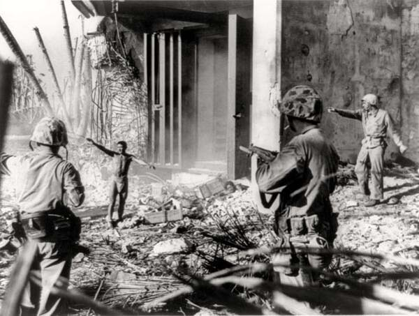 17. A Japanese troop surrendering to US forces.