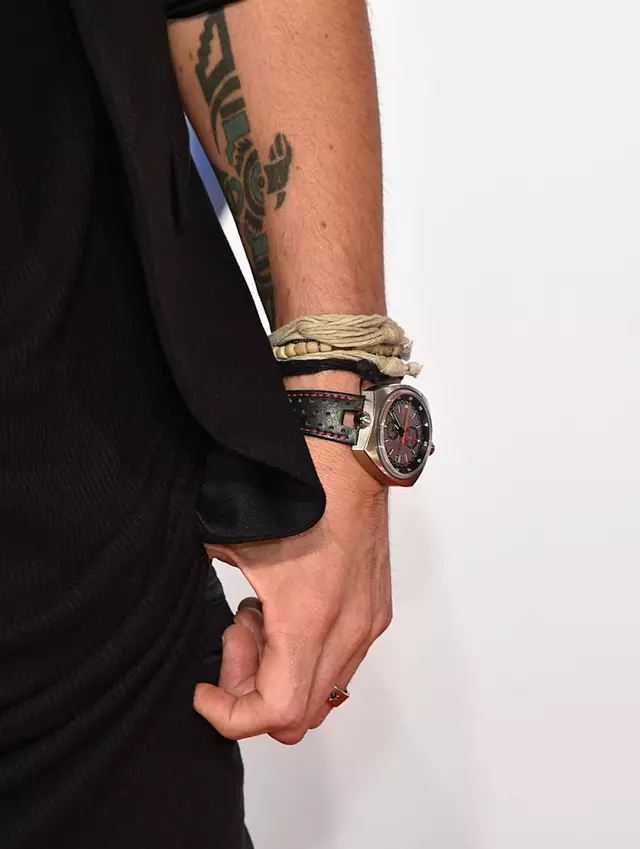 Keith Urban’s tattoos for Nicole Kidman span from a bold bicep piece to knuckle ink and her full initials on his wrist.