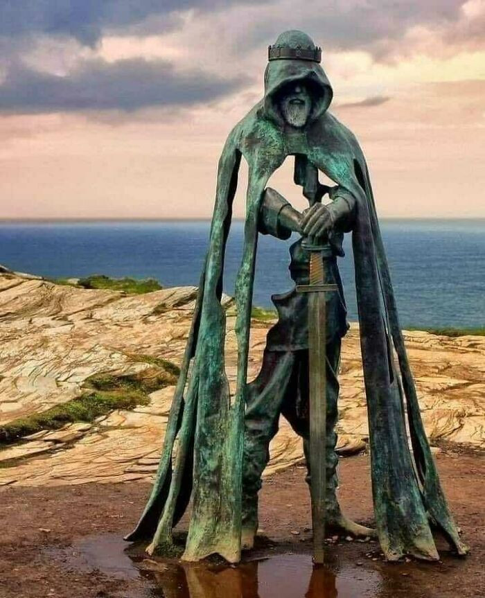 24. Cornwall, England, the statue of King Arthur stands proudly on the cliffs of Tintagel, gazing out over the vast expanse of the Atlantic Ocean