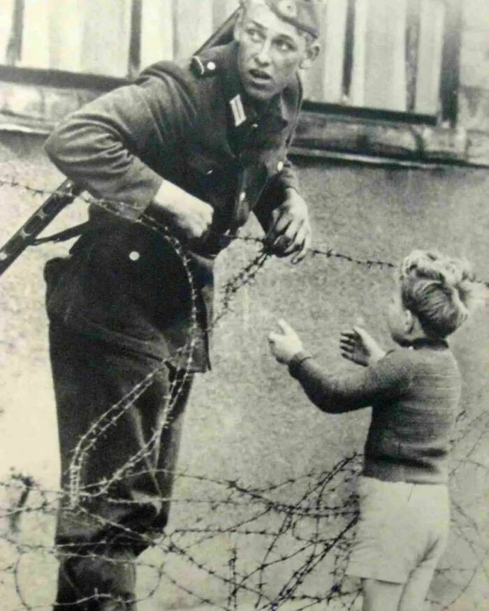 9. In 1961, on the day the Berlin Wall was erected, an East German soldier provided assistance to a young boy in sneaking across the barrier