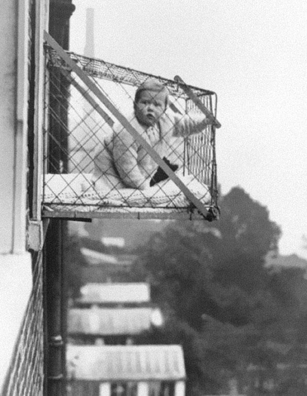 Baby casually soaking up that afternoon breeze through the innovative ‘baby cages’ brought to us by the 1930s. Because how else is a baby supposed to get enough air?