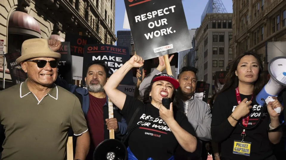 A group of passionate supporters rally near San Francisco's Union Square. They're standing in solidarity with hotel workers demanding fair pay and better working conditions.