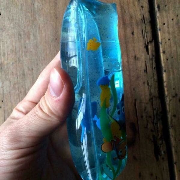 Water-filled plastic tube with a plastic fish inside