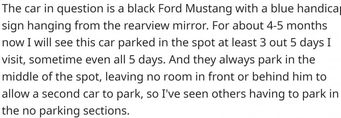 The car in question is a black Ford Mustang with a handicap sign
