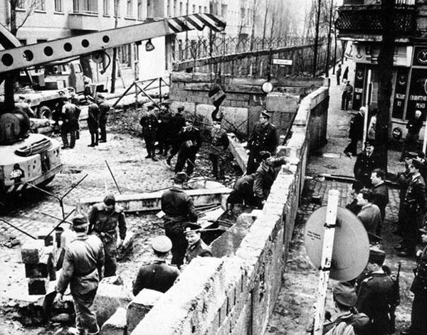 Witness the Berlin Wall rising brick by brick in 1961.