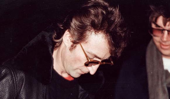 2. The final photo of John Lennon, featuring his soon-to-be assassin, Mark David Chapman, seeking an autograph.