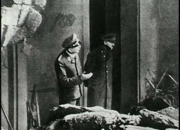 1. Adolf Hitler gazing at Berlin's ruins outside his bunker only two days before his death