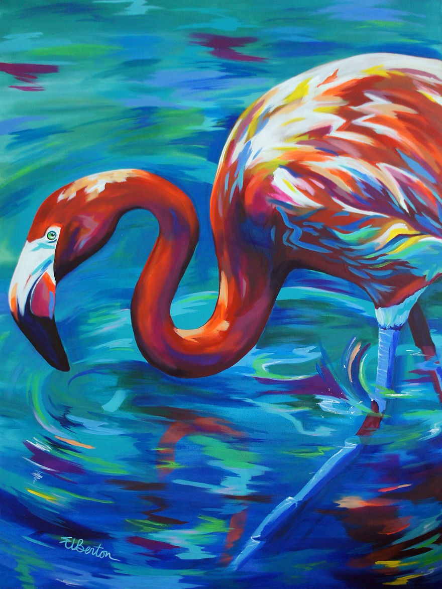 7. The brightly coloured flamingo seeks to take in some colorful water for hydration