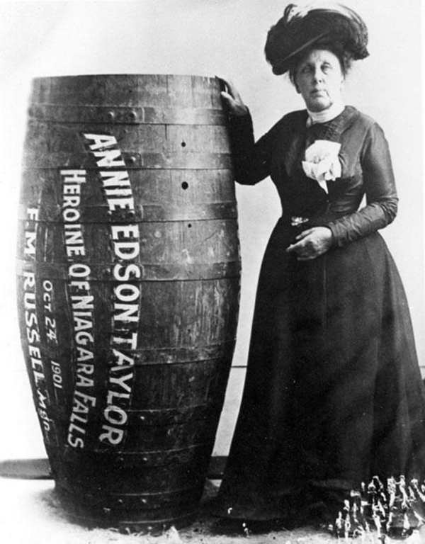 Annie Edison Taylor makes history in 1901 as the first person to survive going over Niagara Falls in a barrel