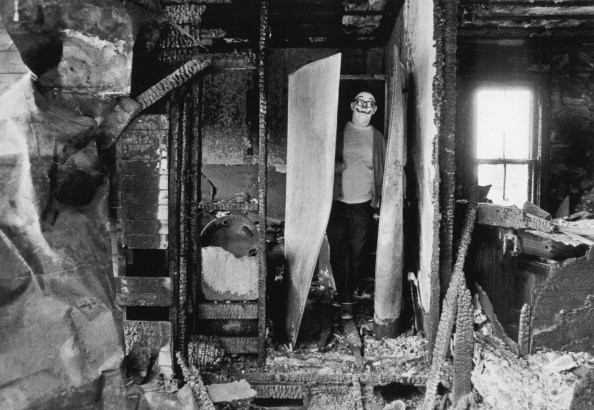 21. A clown in a burnt-out house, USA, 1975